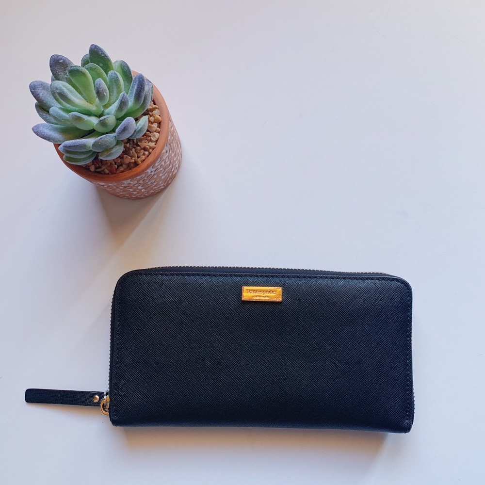 Kate Spade spencer zip-around continental wallet.